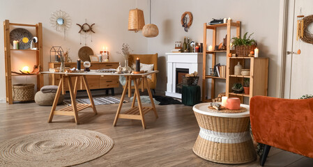 Interior of witch's room with magic attributes, table and shelf units
