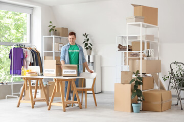 Male volunteer with donations in center