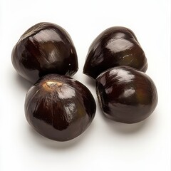 Obraz premium Four glossy chestnuts with a rich, dark brown exterior, showcasing their natural sheen against a neutral background.