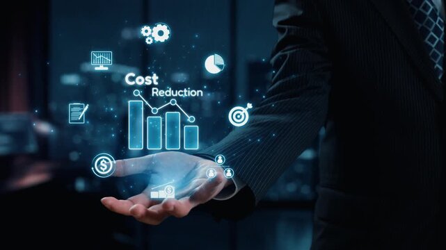 A businessman stands in a modern office, showcasing a digital interface that illustrates cost reduction strategies, featuring graphs, icons, and finance symbols. Qubit