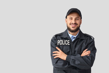Handsome police officer on white background