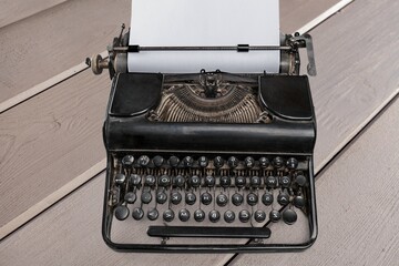 Vintage typewriter on desk. Printing ban concept