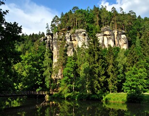 Rocky outcrop and forest by a river