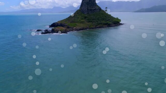 Overlay circles fading triggers camera moving across turquoise ocean, revealing lush island