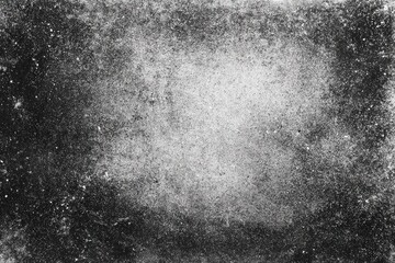 Fototapeta premium A textured, grayscale image with various shades of gray and black. A light area is centered, with darker areas surrounding it. Visible are speckles and irregularities throughout