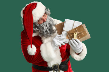 Santa Claus with letters on green background