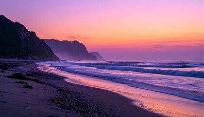 A tranquil beach scene at sunrise, with dramatic purple and pink hues painting the sky and waves.