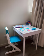 Child's White Desk and Teal Chair with Colorful Artwork