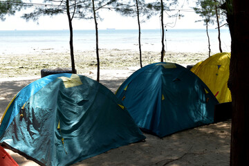 camping tent on the beach © IbunBund Studio
