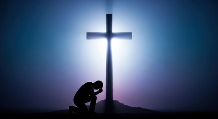 Silhouette of a kneeling man in supplication before the radiant cross under the ethereal sky
