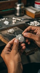 Artisans Hands Crafting Intricate Silver Pendant with Delicate Filigree Details.