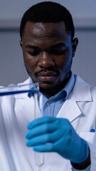 Scientist pipetting cosmetic formula in laboratory
