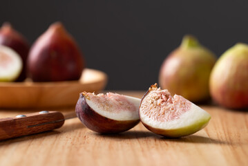 Fresh sliced fig on cutting wooden board, Autumn fruit