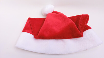 Red Santa hat isolated on white background. Red Santa hat fabric. Christmas holiday concept