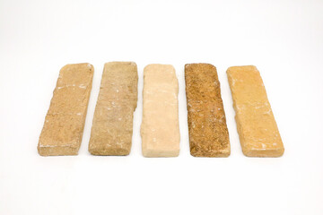 Five Vintage Handmade Bricks with Rustic Texture on White Background