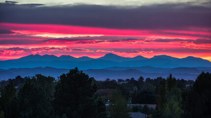 Sunset, beautiful rosy clouds, and the afterglow on the horizon