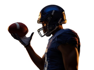 American football player holding ball in hand with focused intensity under spotlight