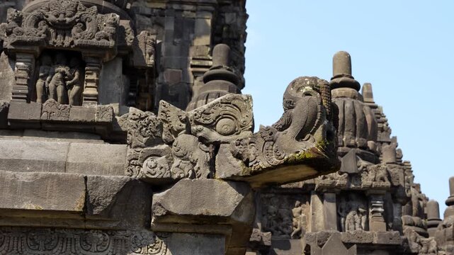 Close-up detailed view of statues and carvings of Prambanan Hindu temple