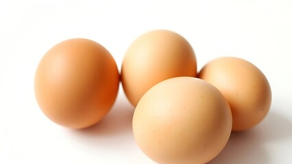Simple composition of brown eggs on a pure white background, highlighting natural beauty.