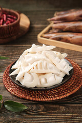 Fresh bamboo shoots from Jianou Fujian China sliced in bowl on bamboo mat traditional Asian spring vegetable ingredient