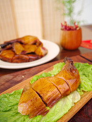 Sliced Roasted Duck with Crispy Skin on Lettuce Leaves - Traditional Asian Cuisine
