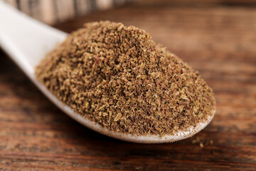 Ground Spice Powder with Red Pepper Flakes on Wooden Spoon - Seasoning Ingredient