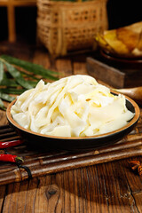 Fresh Bamboo Shoots in Traditional Bowl on Wooden Surface - Asian Cuisine Ingredient