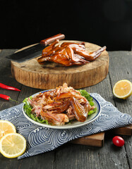 Cantonese Style Preserved Duck Casserole with Gourmet Aromatic Flavor on Rustic Wood Background