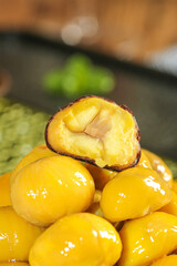 Fresh Roasted Chestnuts with Cracked Open Kernel Showing Golden Interior Meat