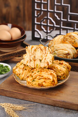 Handmade Scallion Steamed Buns and Breakfast Rolls on Wooden Board - Traditional Asian Pastries with Fresh Herbs