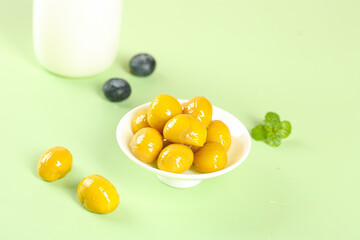 Fresh Glazed Chestnuts with Milk and Blueberries on Green Background - Yunnan Alpine Fruit Composition