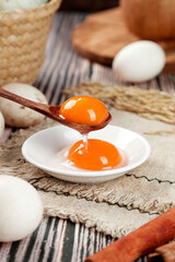 Fresh Farm Eggs with Orange Yolks on Rustic Wooden Table - Organic Poultry Farming Ingredients