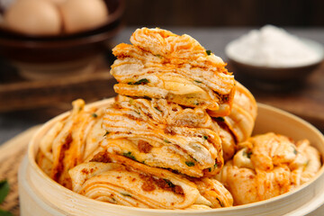Homemade Spicy Scallion Pork Pancakes in Bamboo Steamer - Traditional Asian Handmade Layered Rolls