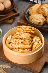 Homemade Spicy Scallion Pork Buns in Bamboo Steamer - Traditional Asian Savory Rolls