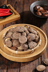 Dried Shiitake Mushrooms in Bamboo Basket Fresh Asian Cooking Ingredients on Wood Table