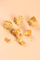 Crispy Fried Noodle Balls Traditional Guangxi Chinese Snack Specialty on Peach Background