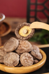 Fresh Shiitake Mushrooms in Wooden Bowl - Asian Cooking Ingredients for Hotpot Base
