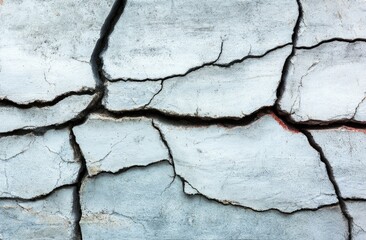 Close-up of cracked, light gray surface