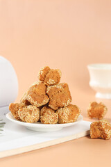 Traditional Chinese Sesame Seed Balls Crispy Pastries on White Plate Guangxi Specialty Food