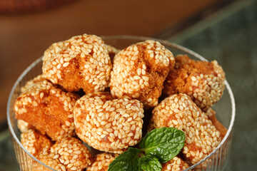 Traditional Guangxi Sesame Balls - Golden Crispy Chinese Sweet Snacks with Mint Garnish
