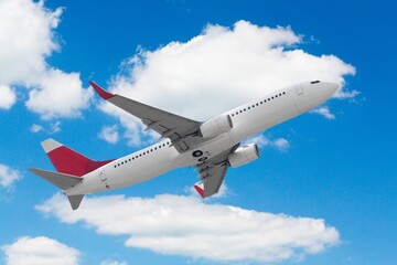 Airplane flying in blue sky, for travel concept