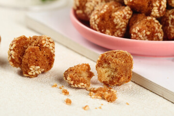 Traditional Chinese Sesame Balls Guangxi Specialty Crispy Sweet Dessert in Pink Bowl