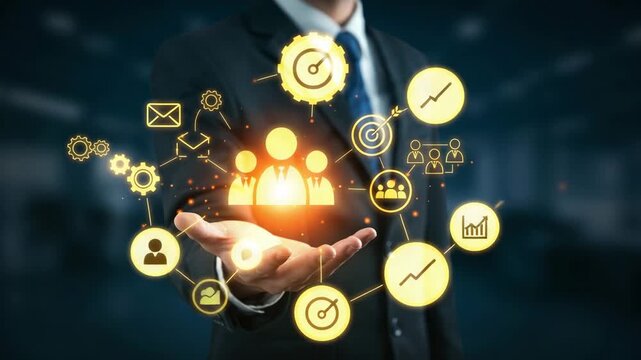 Businessman holding a glowing digital interface with icons representing teamwork, communication, and business processes, signifying collaboration and organizational synergy - Powered by Adobe