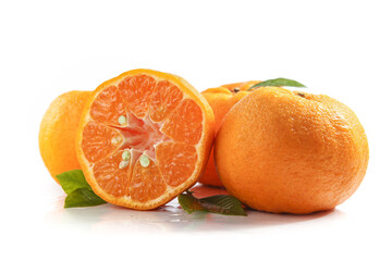 Fresh Thin-Skinned Tangerine Oranges Whole and Sliced with Green Leaves on White Background