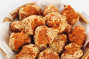 Crispy Sesame Balls - Traditional Guangxi Fried Snacks in Bamboo Basket, Golden Chinese Street Food Specialty