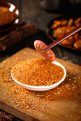 Red Chili Powder Spice in Bowl with Wooden Spoon - Barbecue Seasoning Ingredients for Cooking