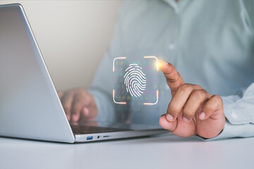 Biometric fingerprint scan authentication on laptop with digital security technology, Businessman using fingerprint recognition for identity verification and data protection with laptop in workplace
