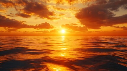 Obraz premium Sea Waves Reflecting Golden Sunlight With Orange Clouds Over Horizon At Sunset