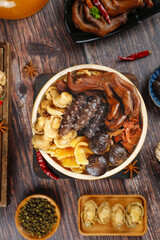 Chinese Snake Soup Traditional Herbal Medicine Bowl with Mushrooms and Spices on Wooden Table