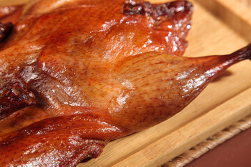 Cantonese Style Roasted Duck with Glossy Skin on Bamboo Board - Traditional Chinese Gourmet Food